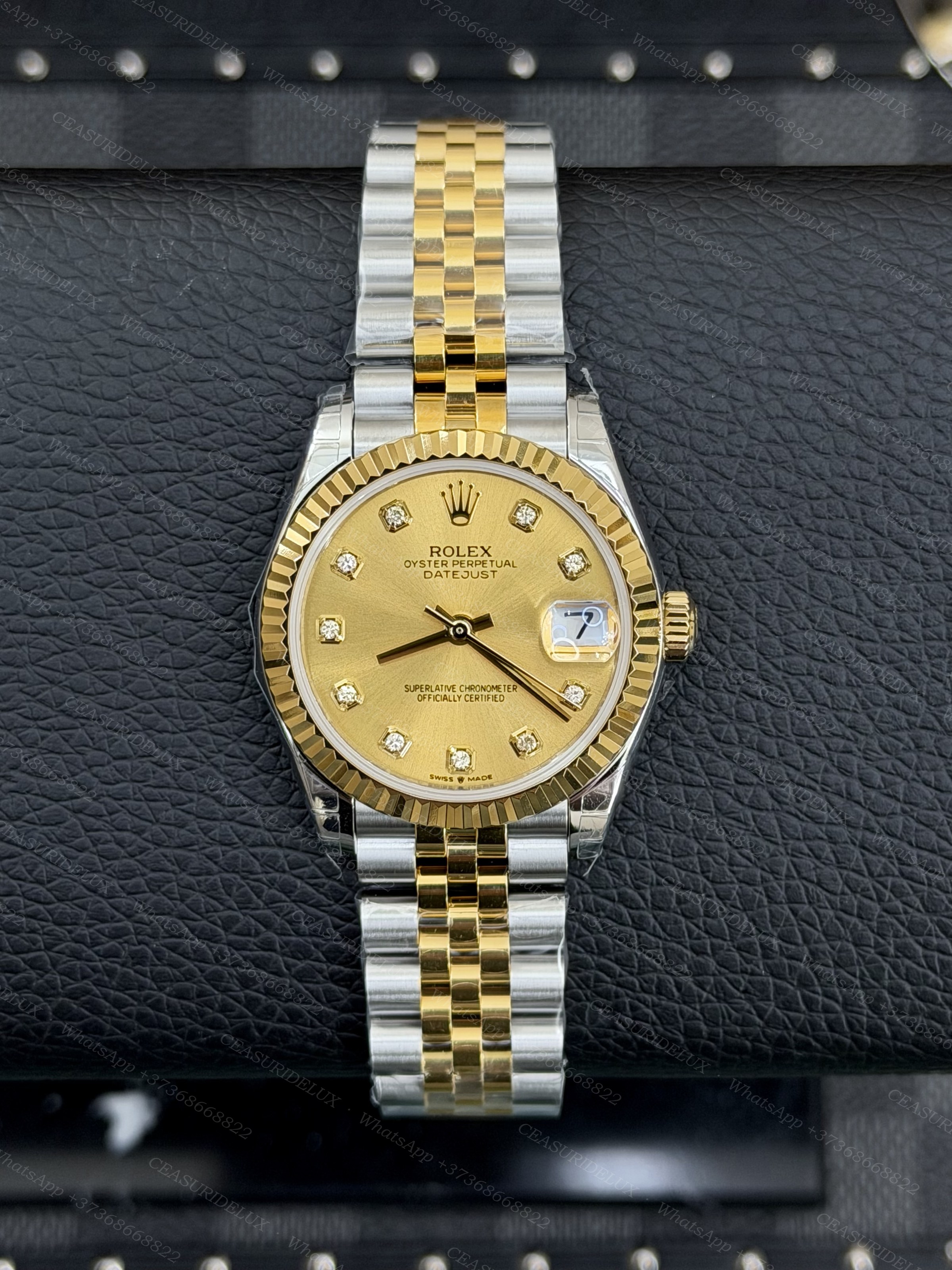 Rolex Datejust 31 Two-Tone Steel + Yellow Gold — Champagne Diamond Dial Background
