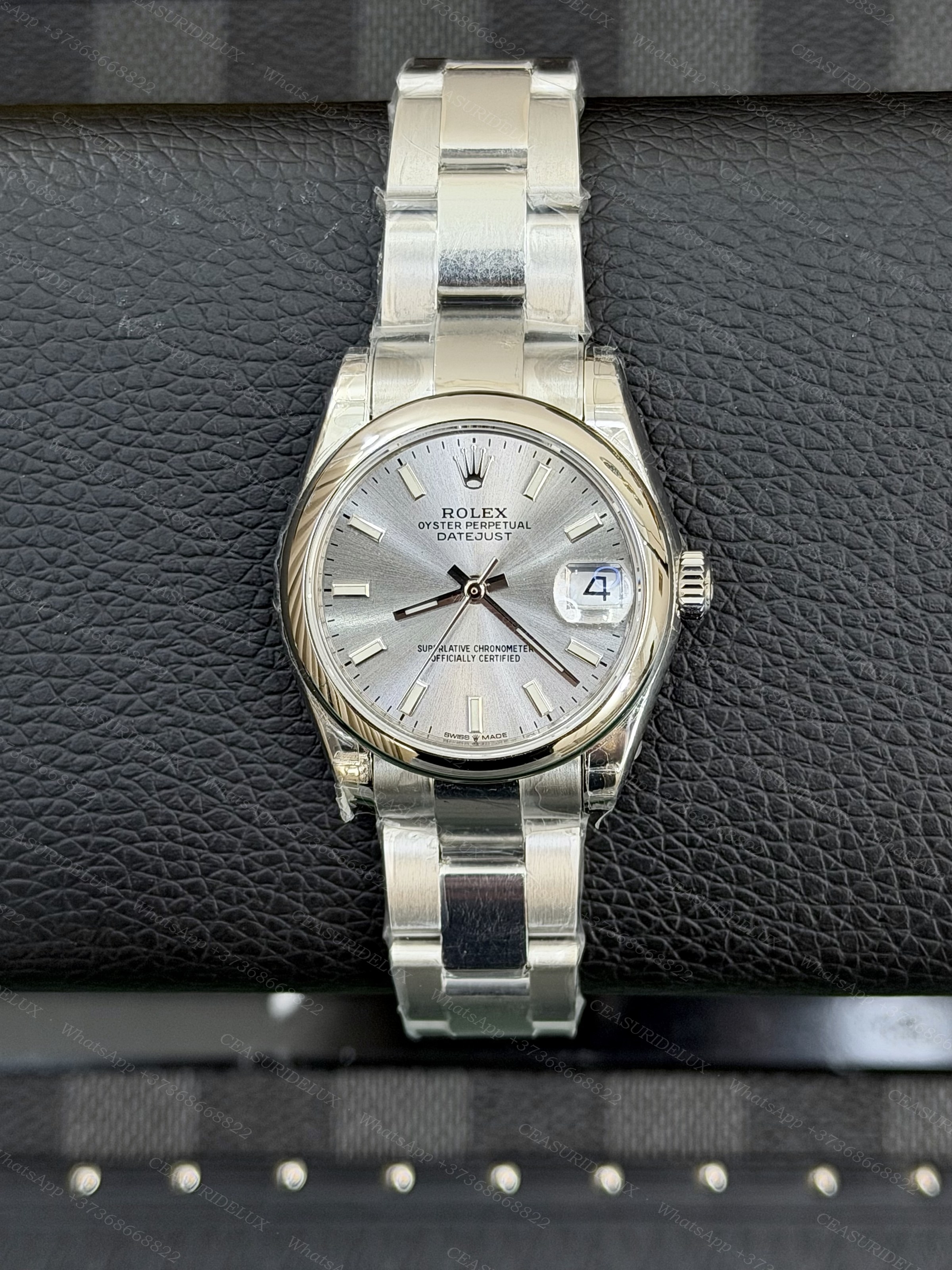 Rolex Datejust 31 Steel — Silver Index Dial (Smooth Bezel + Oyster) Background