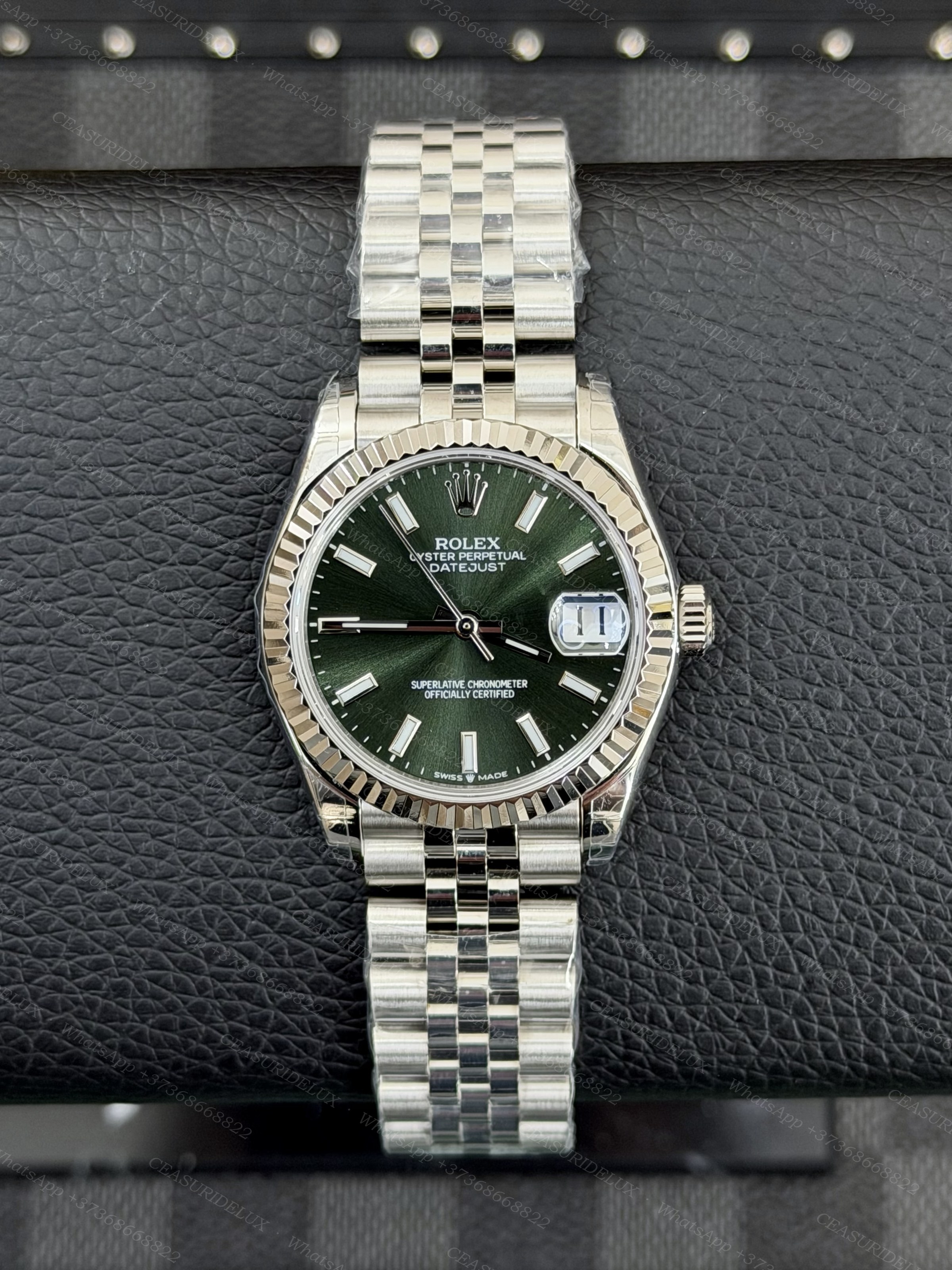 Rolex Datejust 31 Steel — Olive Green Index Dial (Fluted + Jubilee) Background