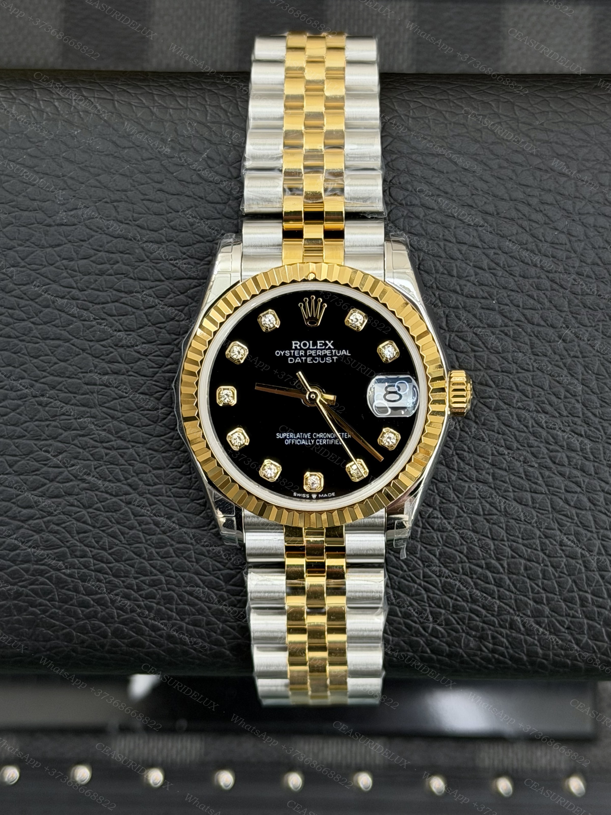 Rolex Datejust 31 Two-Tone Steel + Yellow Gold — Black Diamond Dial Background