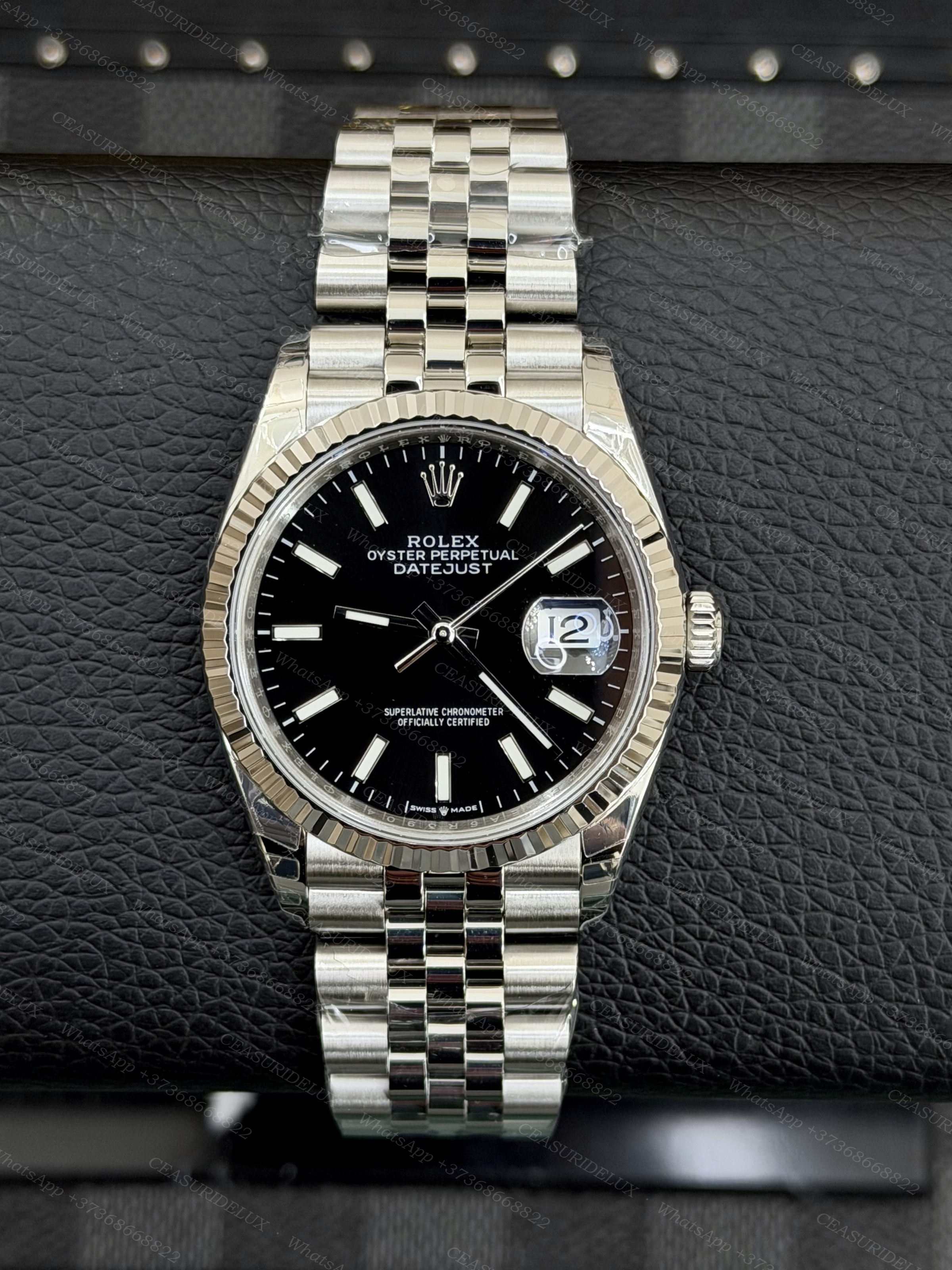 Rolex Date-Just 36 Steel/White Gold — Black Dial + Jubilee (126234) Background
