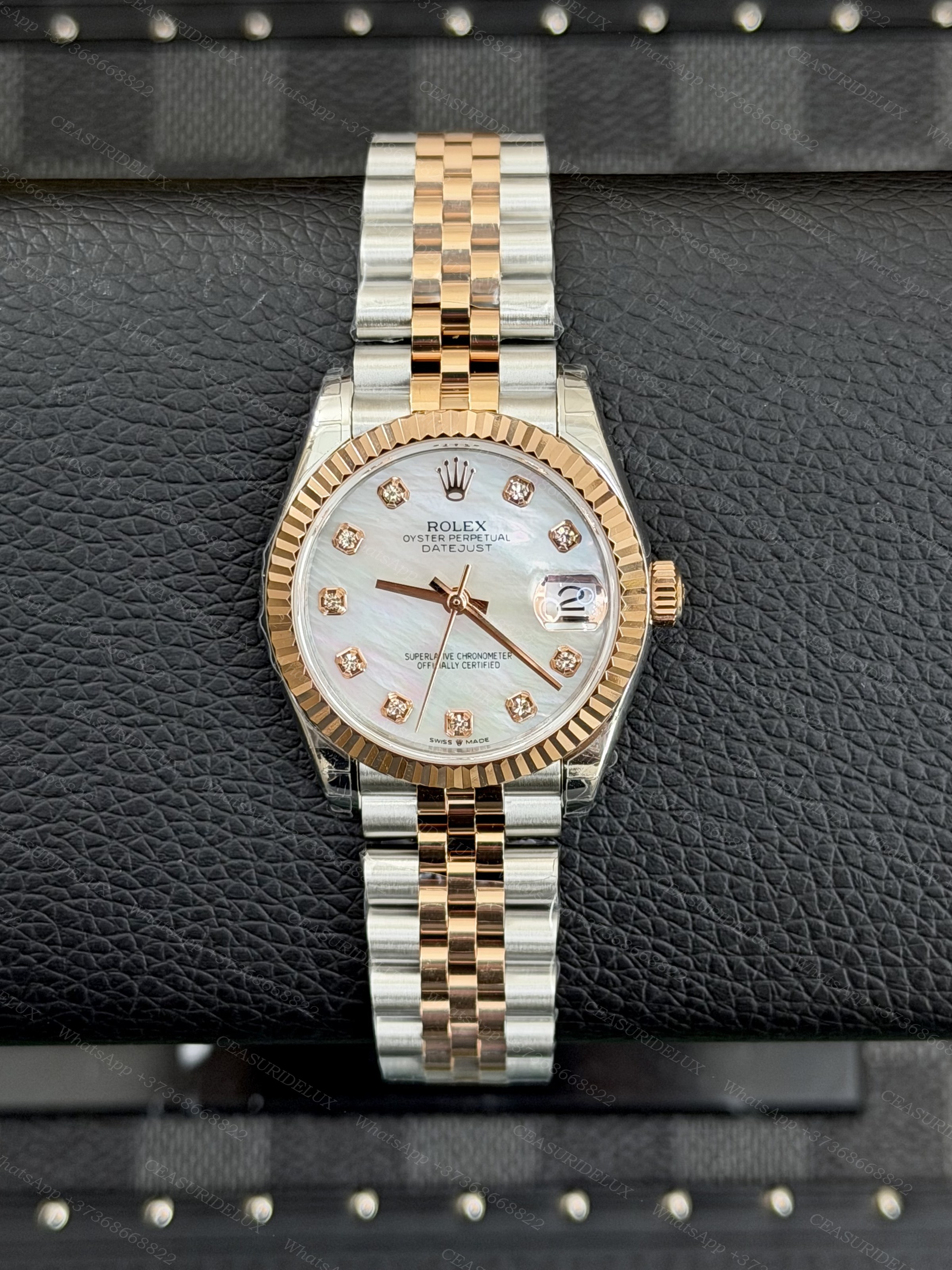 Rolex Date-Just 31 Everose Rolesor White Mother-of-Pearl Diamond Dial Background