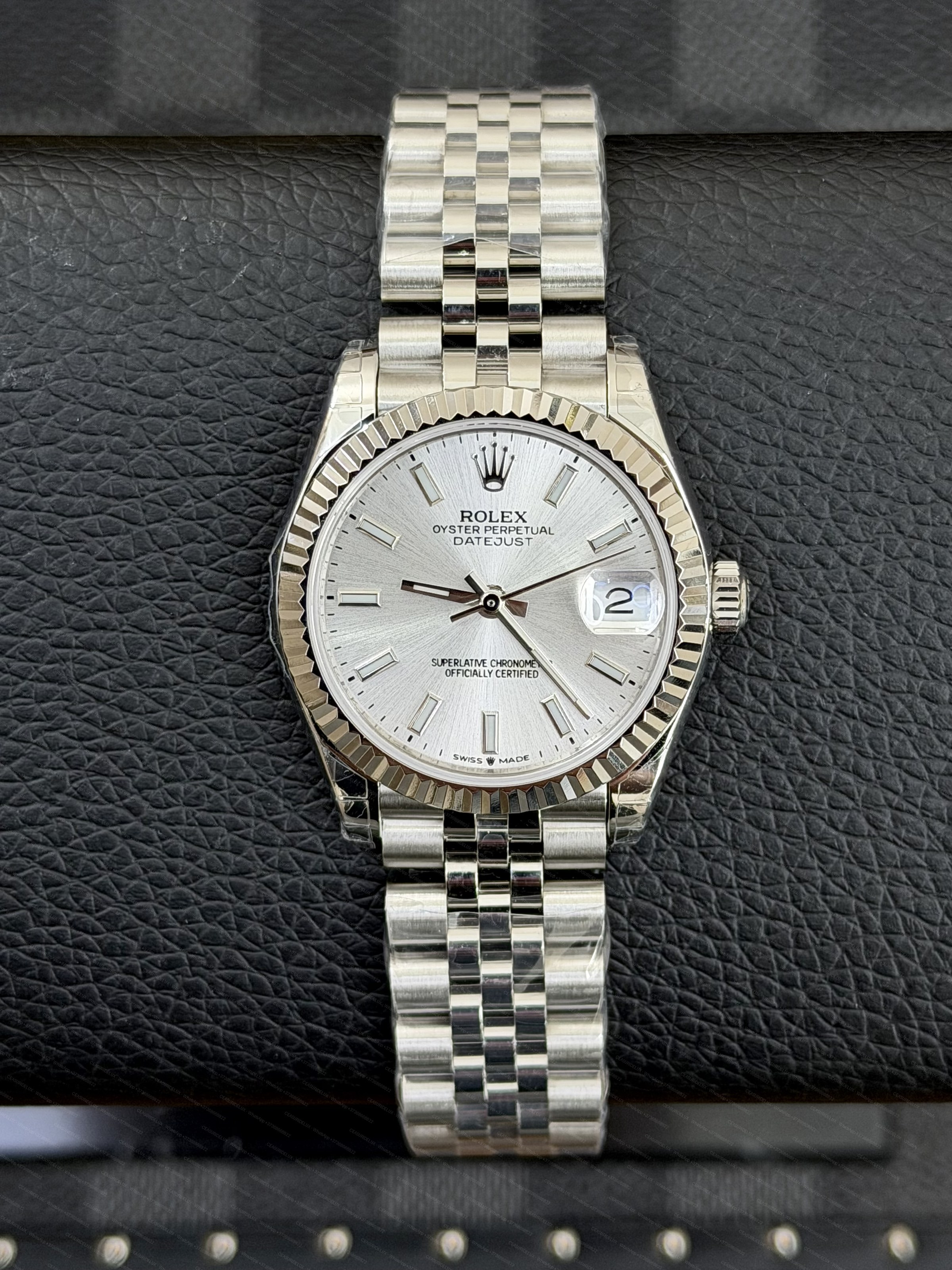 Rolex Rolex Date-Just 31 Silver Index Dial Stainless Steel Background